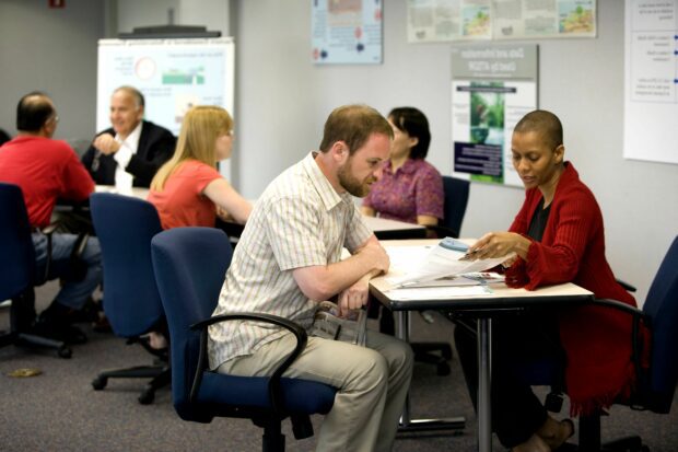 6 people working together in groups of two